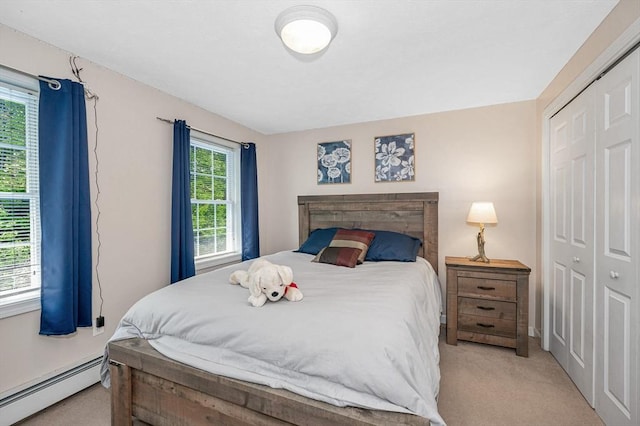 37 Sylvan Rd, Gardner, MA 01440 - bedroom featuring a baseboard radiator, a closet, and light carpet