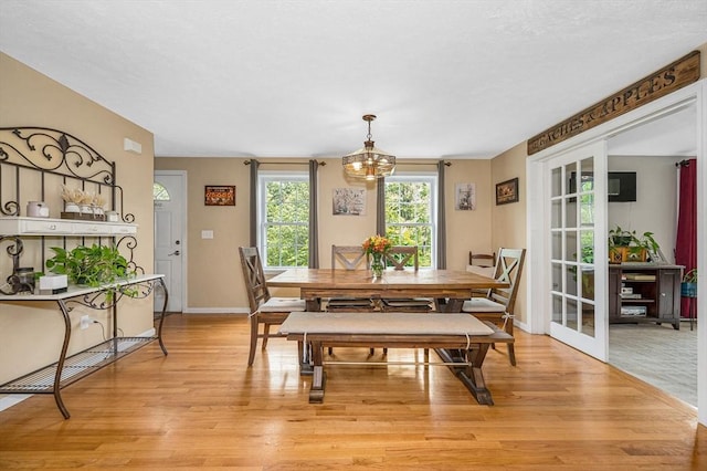 37 Sylvan Rd, Gardner, MA 01440 - dining space featuring light wood-type flooring, baseboards, and a chandelier