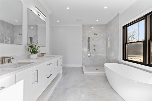 bathroom with recessed lighting, marble finish floor, a walk in shower, and a sink