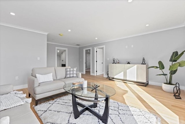 living room featuring recessed lighting, wood finished floors, and baseboards