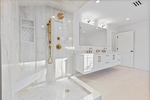 bathroom featuring a marble finish shower, visible vents, double vanity, and crown molding