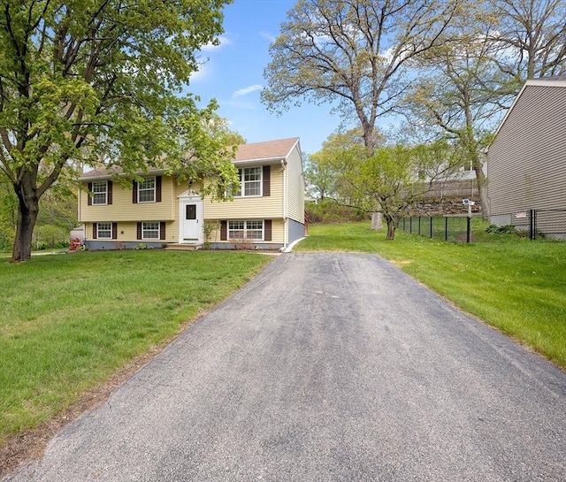 raised ranch featuring driveway