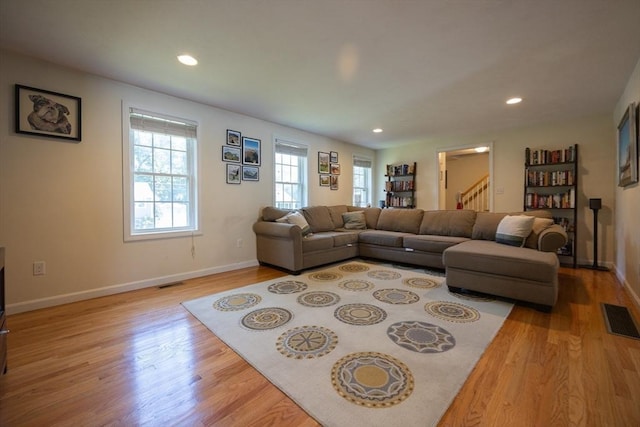 22 Hartley Ave, Brockton, MA 02302 - living room with light wood finished floors, stairway, and recessed lighting