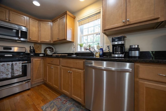 22 Hartley Ave, Brockton, MA 02302 - kitchen with appliances with stainless steel finishes, light wood-style flooring, recessed lighting, brown cabinets, and dark stone counters