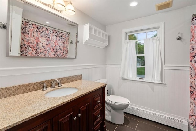 21 Autumn Ln, Marion, MA 02738 - full bath with baseboard heating, tile patterned flooring, a wainscoted wall, toilet, and vanity