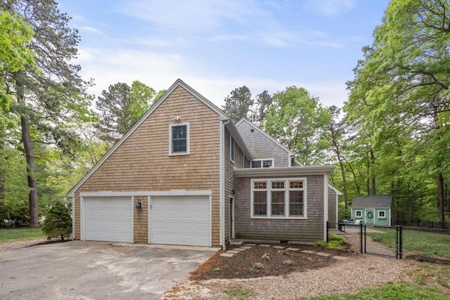 21 Autumn Ln, Marion, MA 02738 - view of front of house with an attached garage and driveway