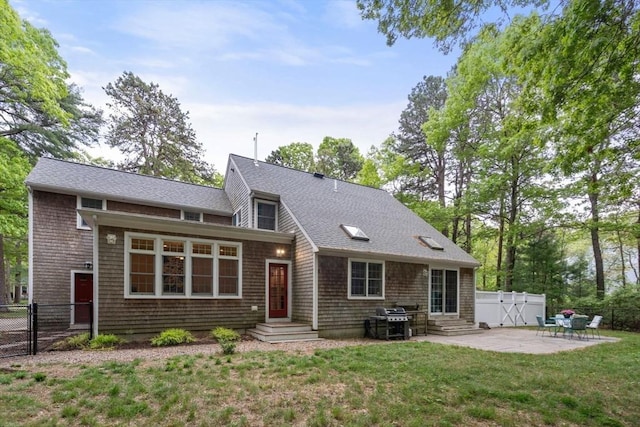 21 Autumn Ln, Marion, MA 02738 - view of front facade featuring a gate, a patio, roof with shingles, and entry steps
