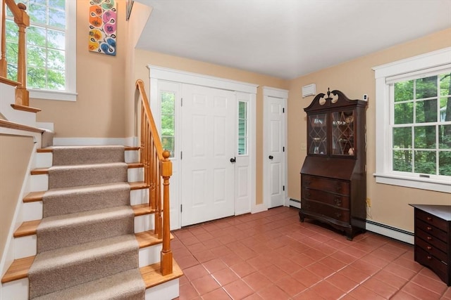 21 Autumn Ln, Marion, MA 02738 - entryway with a baseboard heating unit, stairway, and light tile patterned floors