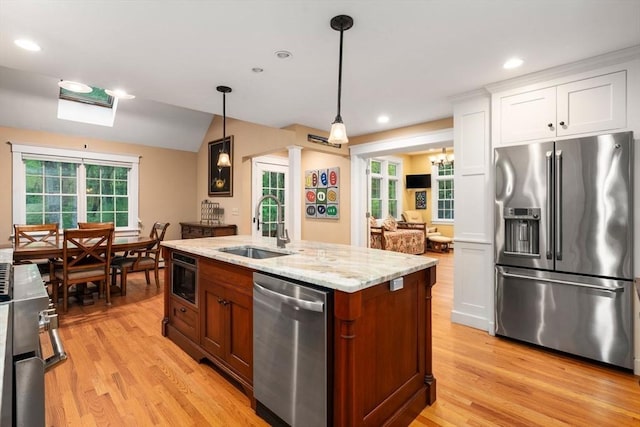 21 Autumn Ln, Marion, MA 02738 - kitchen with appliances with stainless steel finishes, a sink, light wood-type flooring, white cabinets, and plenty of natural light
