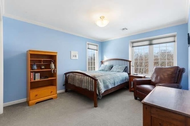 carpeted bedroom with ornamental molding