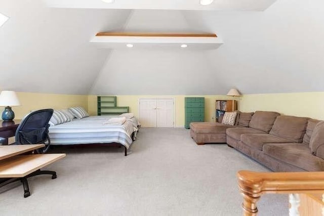 bedroom featuring carpet and lofted ceiling