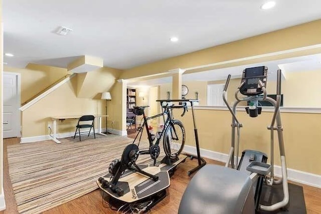 exercise area featuring hardwood / wood-style flooring