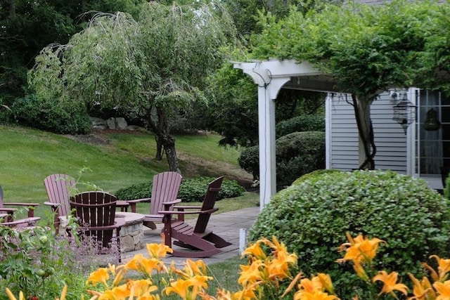 view of yard with a patio and a fire pit