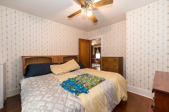 bedroom with dark wood-type flooring and ceiling fan