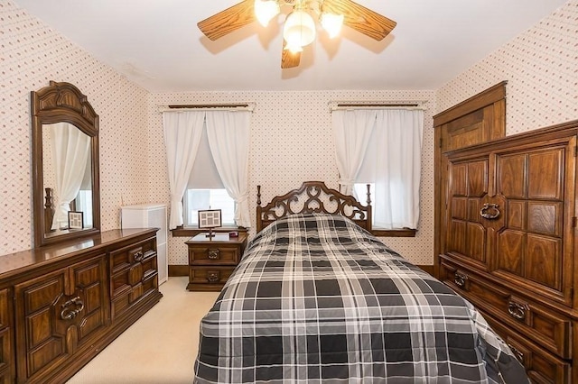 carpeted bedroom with ceiling fan