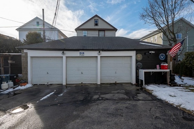 view of snow covered garage