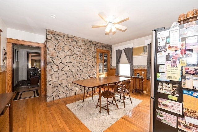 dining room featuring wood-type flooring and ceiling fan