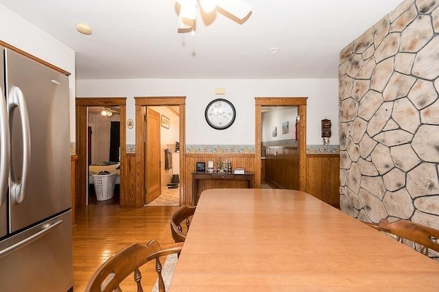 dining space with hardwood / wood-style flooring and ceiling fan