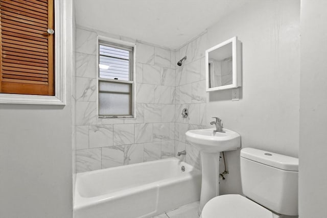 bathroom with toilet and shower / bathing tub combination