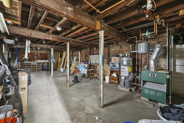 unfinished below grade area with gas water heater and a heating unit