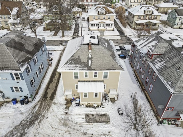 snowy aerial view featuring a residential view