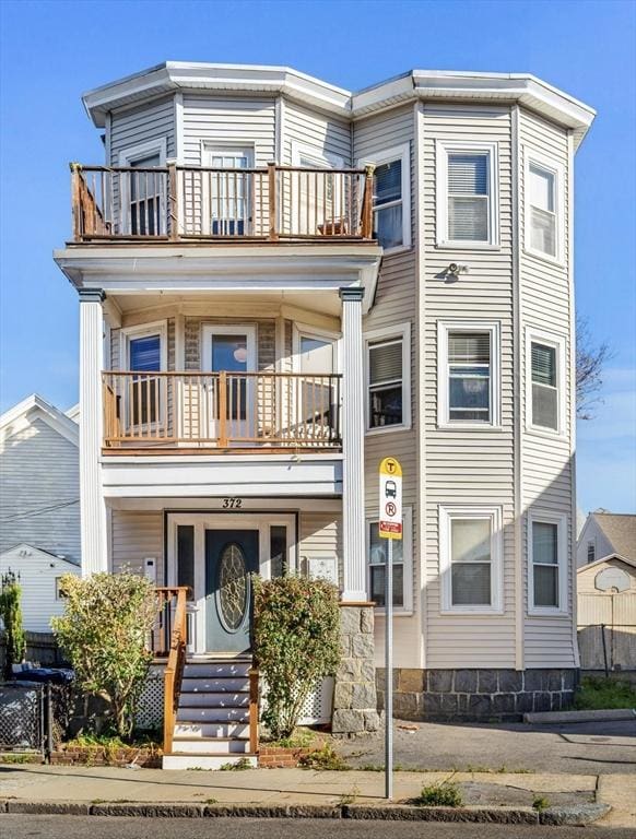 view of front of house featuring a balcony