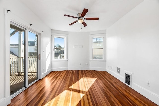 unfurnished room featuring ceiling fan, plenty of natural light, and hardwood / wood-style flooring