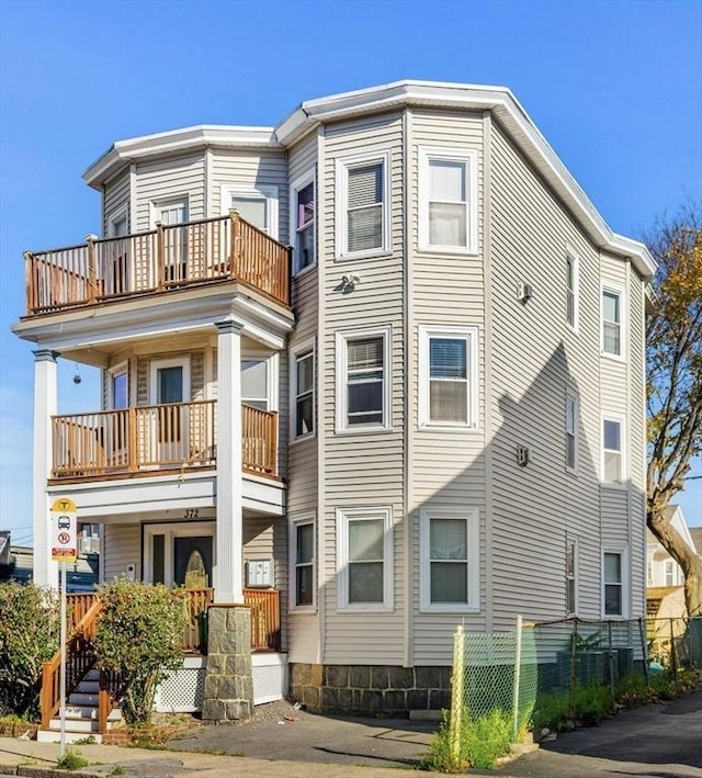 rear view of house featuring a balcony