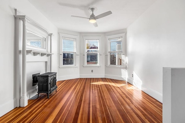 unfurnished room with hardwood / wood-style floors and ceiling fan