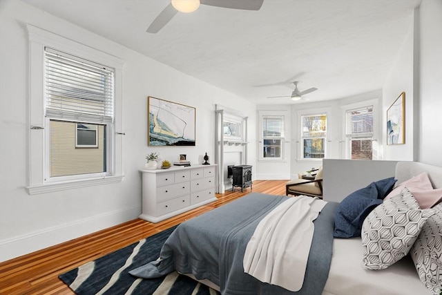 bedroom featuring ceiling fan and hardwood / wood-style flooring