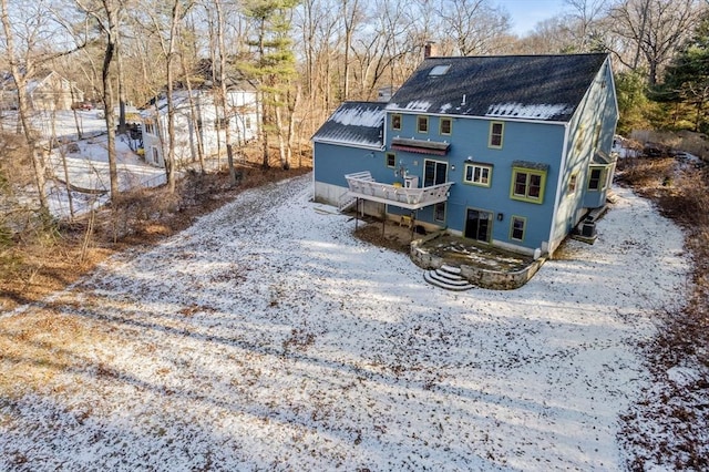 rear view of house featuring a deck