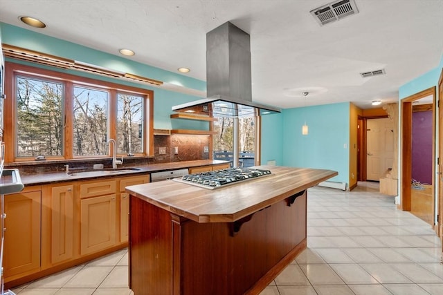 kitchen with a kitchen island, island range hood, sink, dishwashing machine, and backsplash