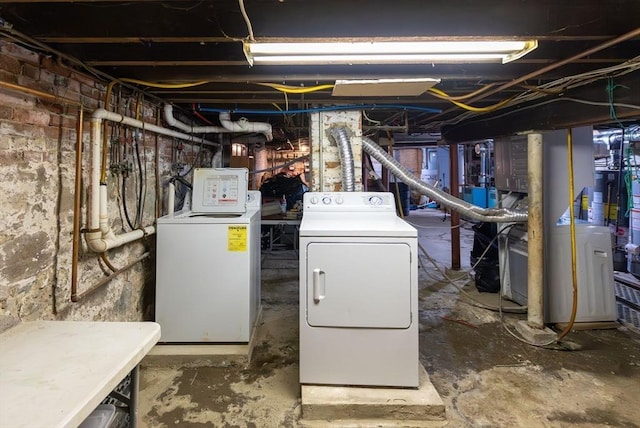 unfinished basement featuring washing machine and dryer