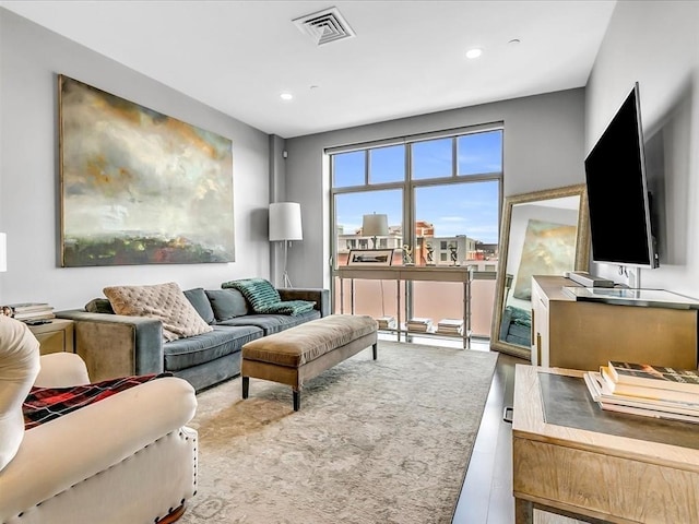 living room with recessed lighting and visible vents