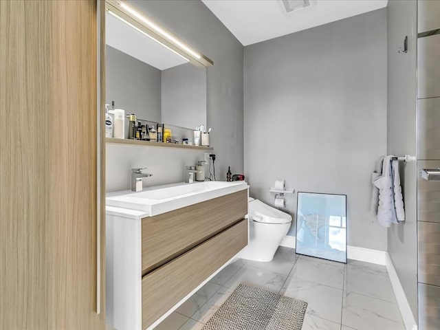 bathroom featuring visible vents, toilet, marble finish floor, baseboards, and vanity