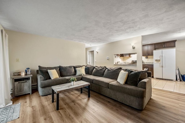 120 Eldridge St Unit 5, Taunton, MA 02780 - living area with light wood-style floors and a textured ceiling