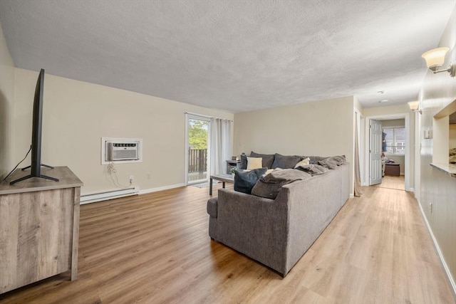 120 Eldridge St Unit 5, Taunton, MA 02780 - living room with baseboard heating, light wood finished floors, a wall mounted AC, a textured ceiling, and baseboards
