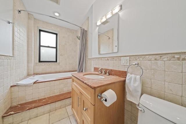 4 Fairbanks Unit 2, Brookline, MA 02446 - full bath with tiled shower / bath, tile patterned floors, toilet, and tile walls