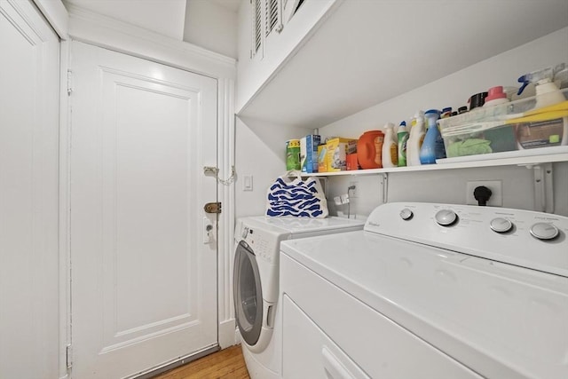 4 Fairbanks Unit 2, Brookline, MA 02446 - washroom featuring laundry area, light wood-style floors, and separate washer and dryer