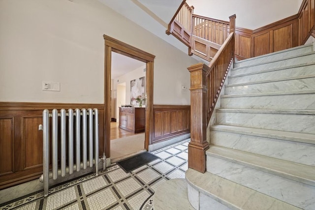 4 Fairbanks Unit 2, Brookline, MA 02446 - staircase featuring radiator and wainscoting