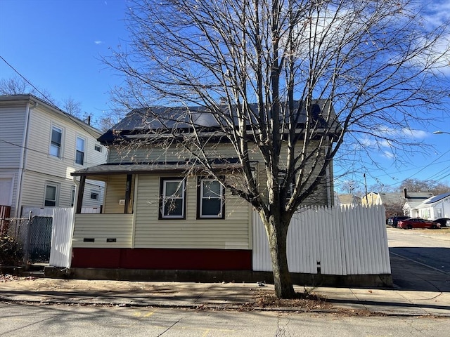 view of property exterior featuring fence