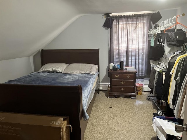 bedroom featuring vaulted ceiling and baseboard heating