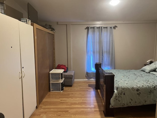 bedroom with light wood-type flooring