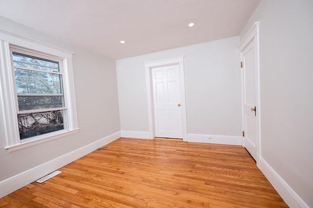 unfurnished room featuring light hardwood / wood-style floors