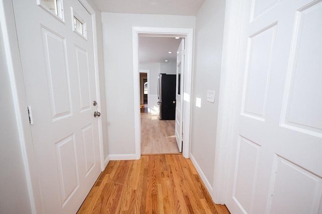 hall with light wood-type flooring