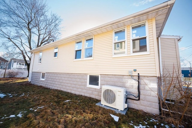 view of side of property with ac unit