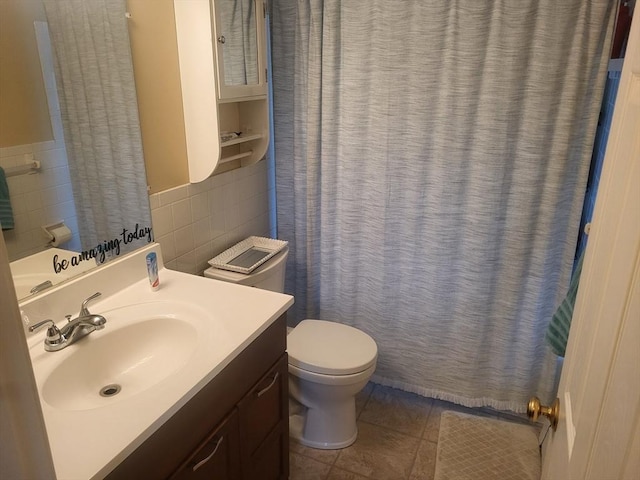 10 Nova Unit B, Pepperell, MA 01463 - bathroom featuring tile walls, toilet, vanity, tile patterned flooring, and curtained shower