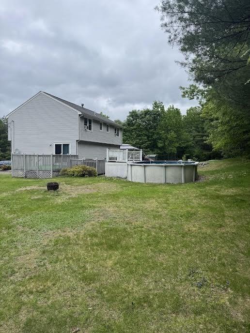 10 Nova Unit B, Pepperell, MA 01463 - view of green lawn featuring a covered pool