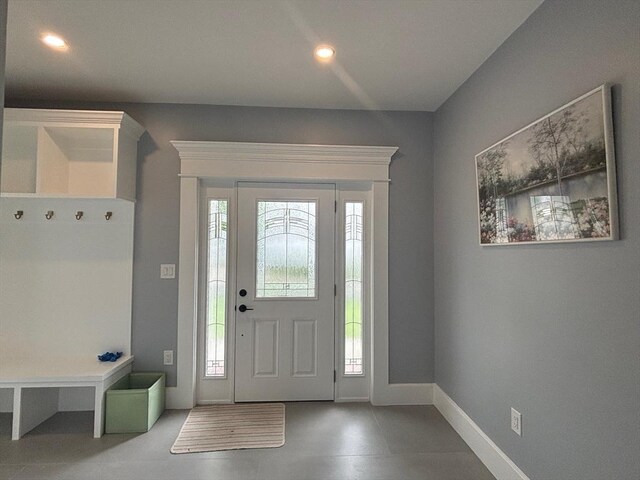 entryway with baseboards and recessed lighting
