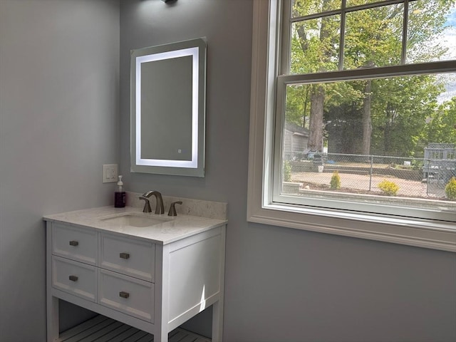 bathroom featuring healthy amount of natural light and vanity